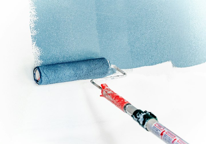 Painting a wall with roller